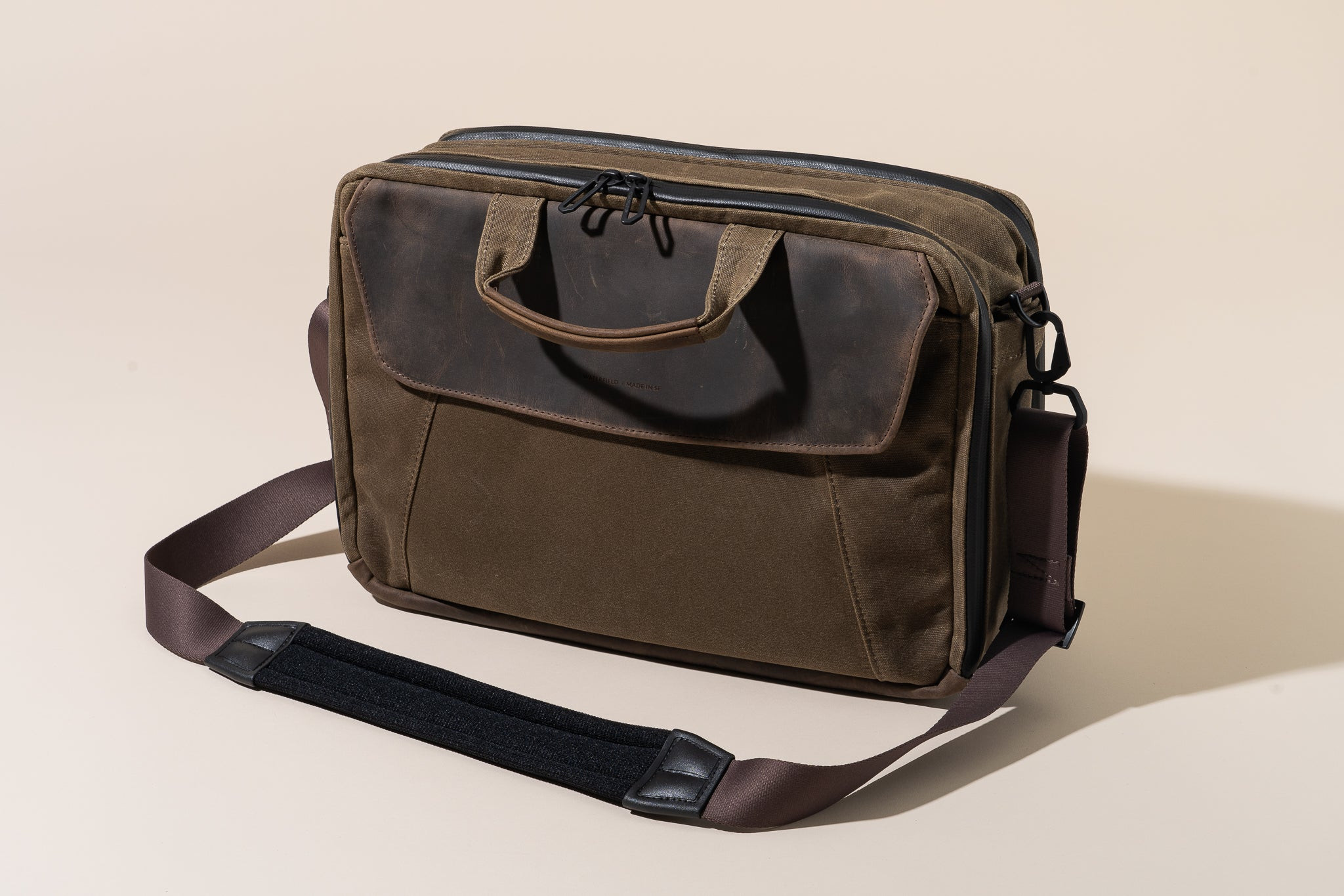 Photo of the Waterfield Air Porter Carry-On Bag on an off-white backdrop