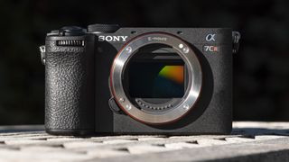 Sony A7C R mirrorless camera outside on a wooden table