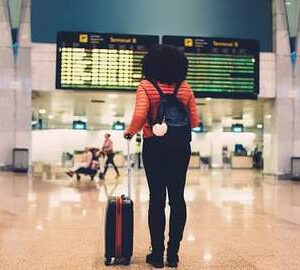 woman looking at departures board